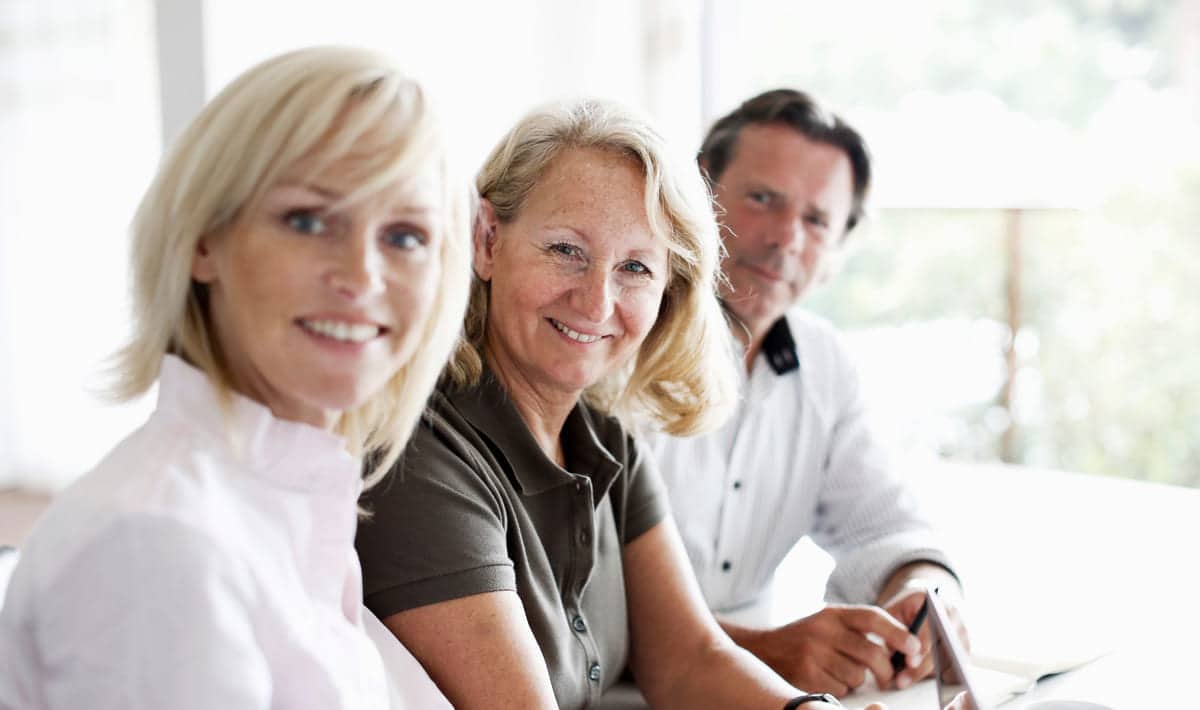 Kultur: Tre kolleger ser i kameraet.