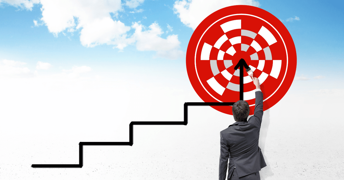 Mann og trapp som peker mot midten av rød blink